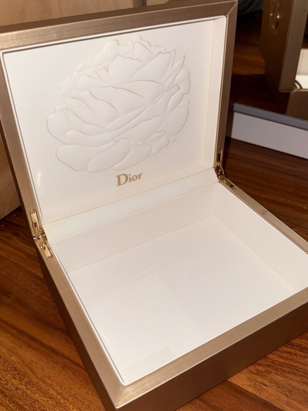 Gold Dior jewelry box with rose design
